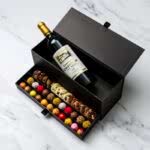 Chest of selections, wine, champagne or liquor with an assortment of chocolate bonbons, truffles and mediants